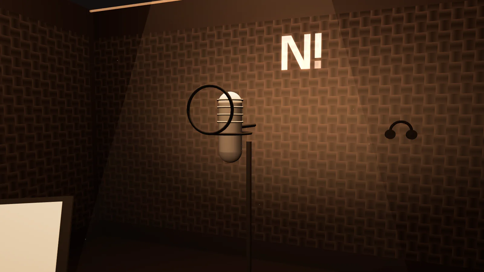 The microphone in the booth under a spotlight